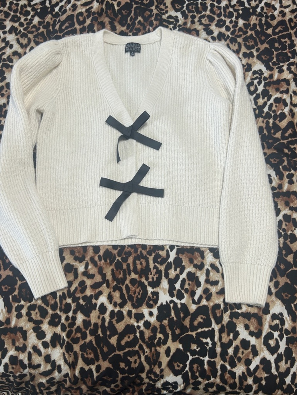 Majorelle Cream V-Neck Sweater with Black Bow Accents